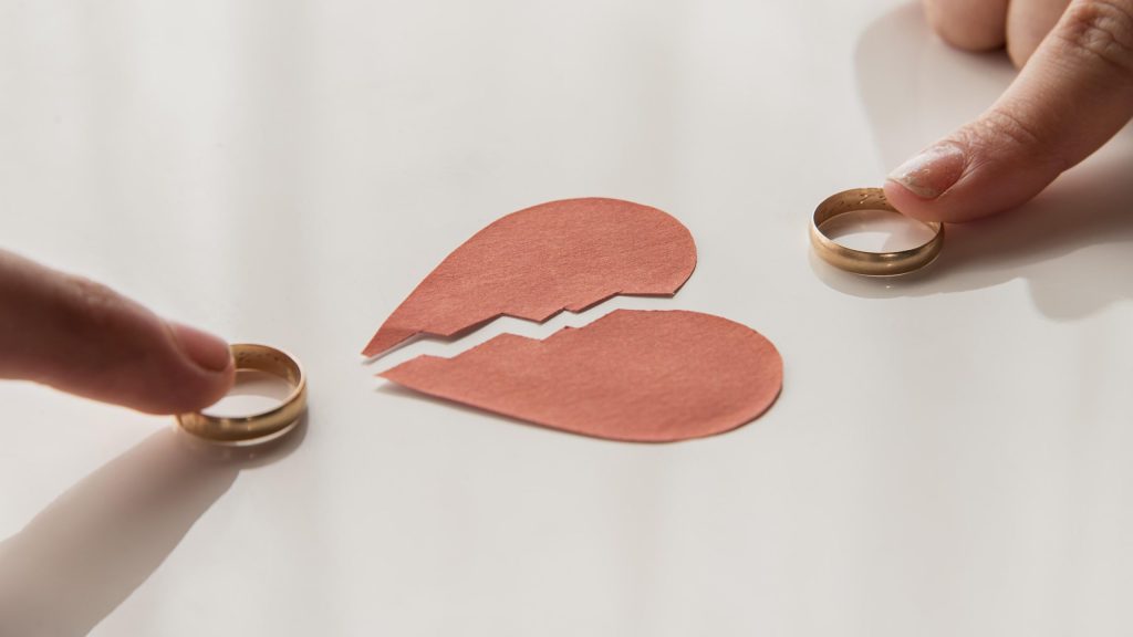 high angle hands touching wedding rings high angle hands touching wedding rings