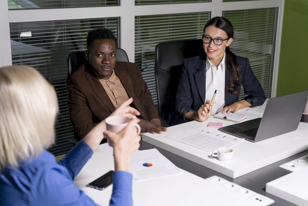 business teammates working late scaled