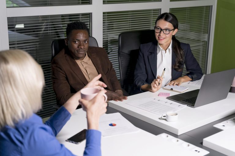 business teammates working late scaled
